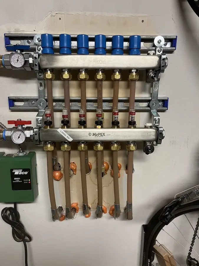 Plumber performing Water Heater Repair at a residential property in Nashua